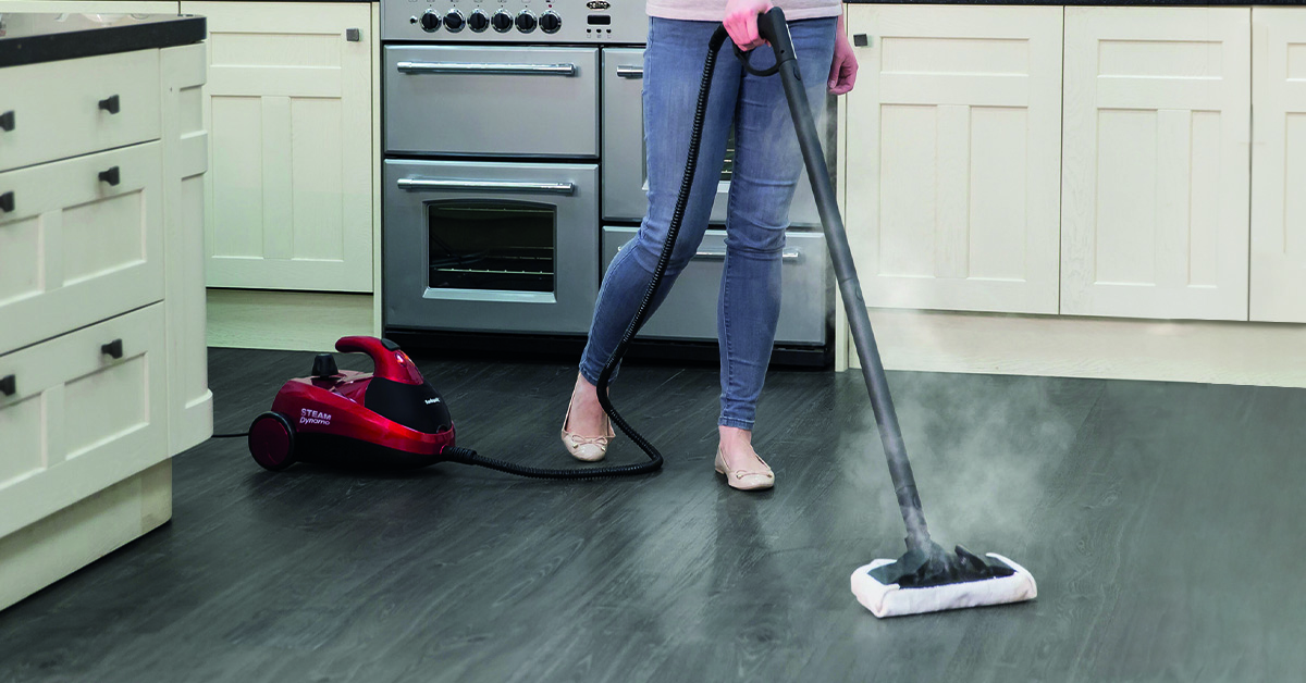 A person vacuuming the floor